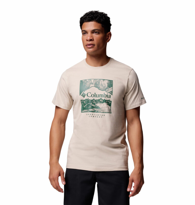 a man wearing a front logo brown tee
