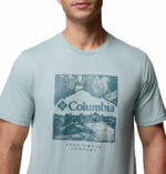 a man wearing a blue csc seasonal logo tee