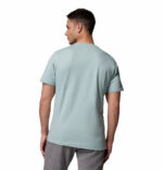 a man wearing a blue csc seasonal logo tee