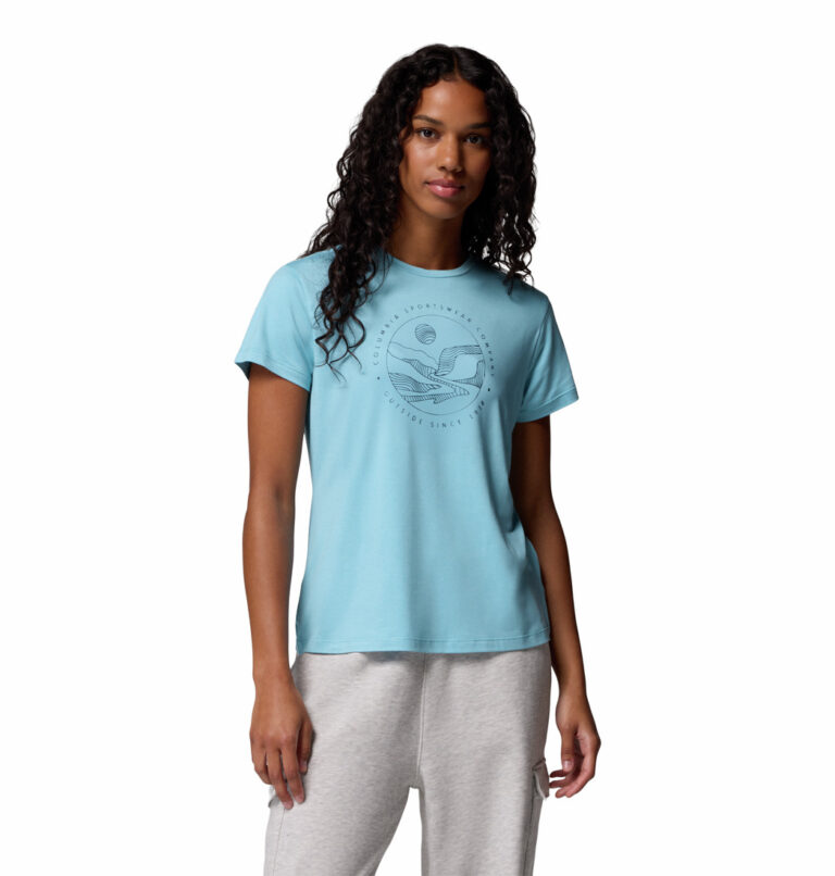 a women wearing a blue short sleeve tee with front graphic