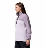 a women wearing a purple half snap pullover fleece top