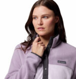 a women wearing a purple half snap pullover fleece top
