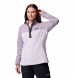 a women wearing a purple half snap pullover fleece top