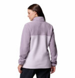 a women wearing a purple half snap pullover fleece top