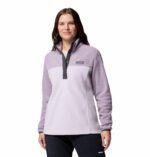 a women wearing a purple half snap pullover fleece top