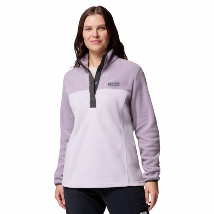 a women wearing a purple half snap pullover fleece top