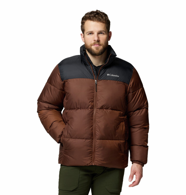 a man wearing a brown black puffy jacket