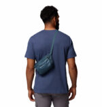 a man wearing a blue hip pack