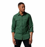 a man wearing a green long sleeve shirt