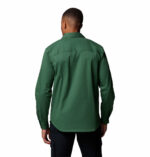 a man wearing a green long sleeve shirt