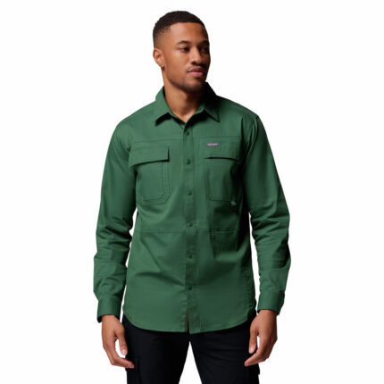 a man wearing a green long sleeve shirt