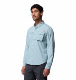 a man wearing a blue long sleeve shirt