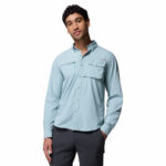 a man wearing a blue long sleeve shirt