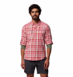 a man wearing a pink flannel long sleeve shirt