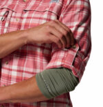 a man wearing a pink flannel long sleeve shirt