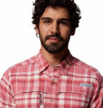 a man wearing a pink flannel long sleeve shirt