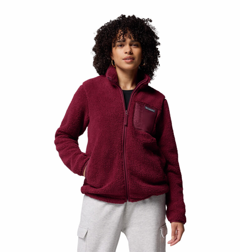 a women wearing a red West Bend II Full Zip fleece jacket
