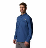 a man wearing a blue long sleeve fishing shirt