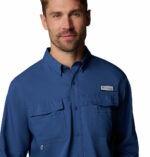 a man wearing a blue long sleeve fishing shirt