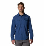 a man wearing a blue long sleeve fishing shirt