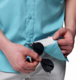 a man wearing a blue short sleeve fishing shirt