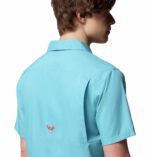 a man wearing a blue short sleeve fishing shirt