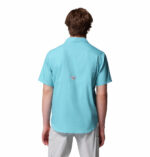 a man wearing a blue short sleeve fishing shirt