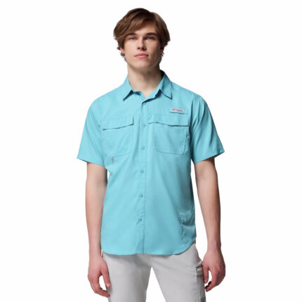 a man wearing a blue short sleeve fishing shirt
