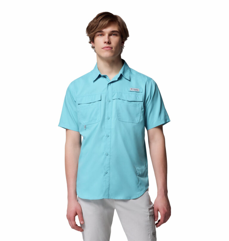a man wearing a blue short sleeve fishing shirt