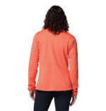 a women wearing a orange essential hike grid half zip fleece