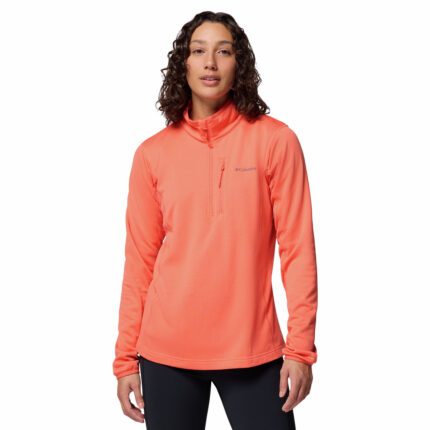 a women wearing a orange essential hike grid half zip fleece