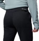 a man wearing a black fleece pants