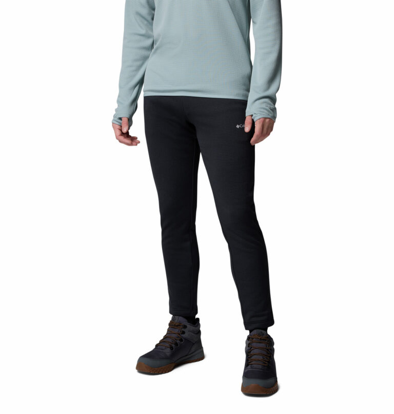 a man wearing a black Essential Hike fleece pants