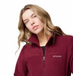 a women wearing a red Fast Trek II Full Zip Fleece Jacket