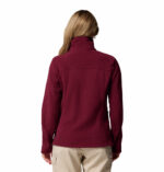 a women wearing a red Fast Trek II Full Zip Fleece Jacket