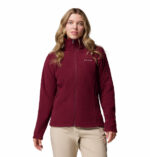 a women wearing a red Fast Trek II Full Zip Fleece Jacket
