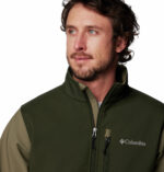 a man wearing a green brown Ascender Softshell Jacket