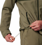 a man wearing a green brown Ascender Softshell Jacket