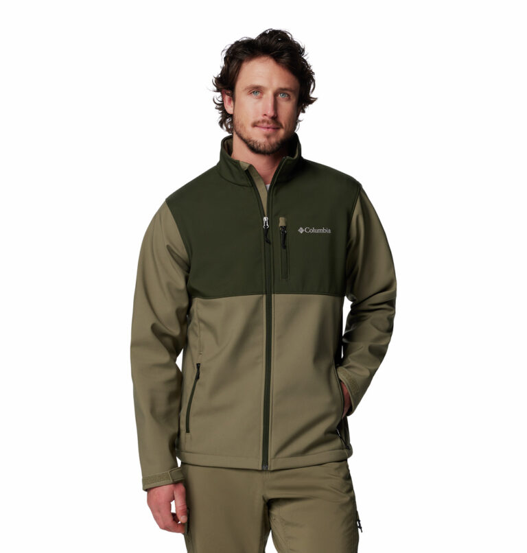 a man wearing a green brown Ascender Softshell Jacket