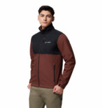 a man wearing a black brown ascender softshell jacket