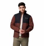 a man wearing a black brown ascender softshell jacket