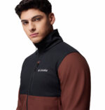 a man wearing a black brown ascender softshell jacket