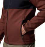 a man wearing a black brown ascender softshell jacket