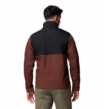 a man wearing a black brown ascender softshell jacket