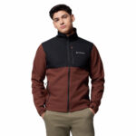 a man wearing a black brown ascender softshell jacket