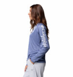 a women wearing a blue Tidal Tee Long Sleeve Shirt
