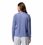 a women wearing a blue Tidal Tee Long Sleeve Shirt