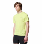 a man wearing a yellow endless trail running tech tee