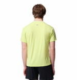 a man wearing a yellow endless trail running tech tee