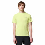 a man wearing a yellow endless trail running tech tee